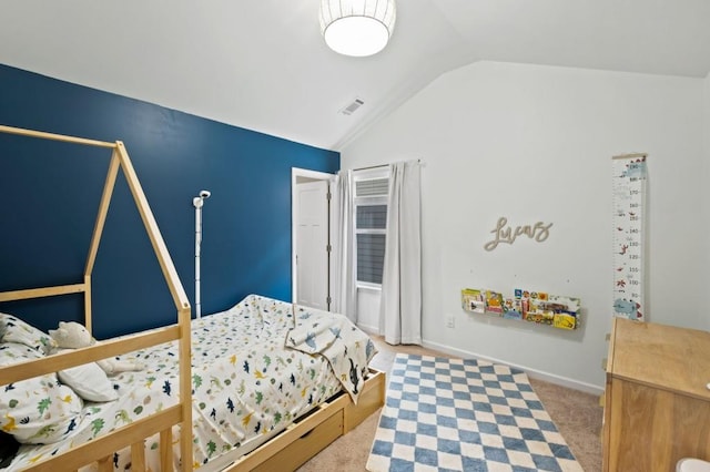 bedroom featuring light carpet and lofted ceiling