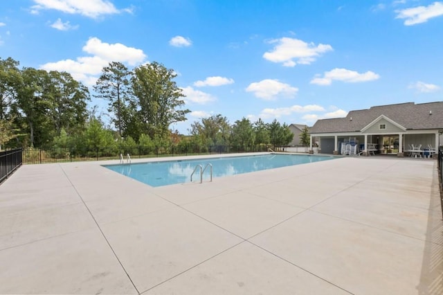 view of swimming pool with a patio area