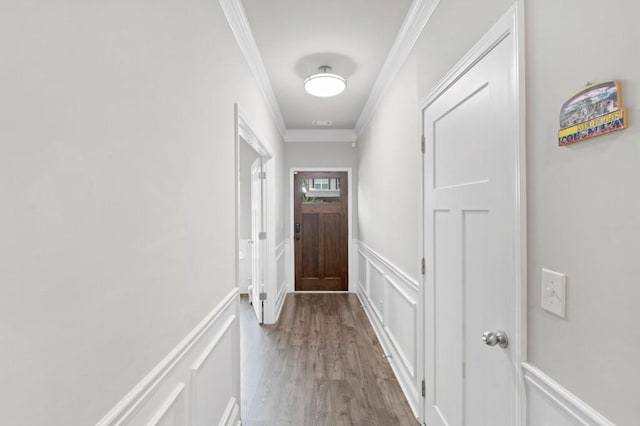 entryway featuring hardwood / wood-style floors and ornamental molding