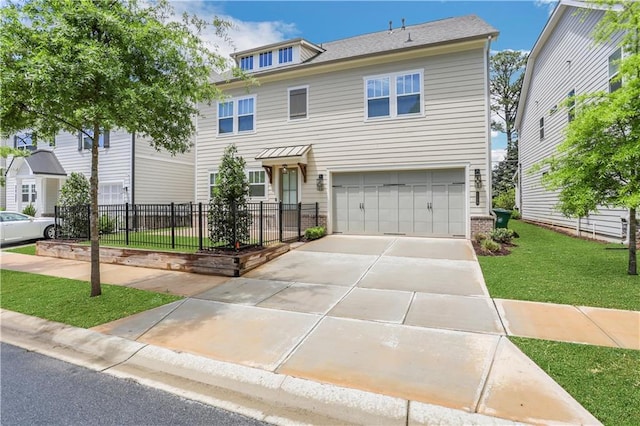 view of front of home with fence, driveway, an attached garage, a front lawn, and brick siding