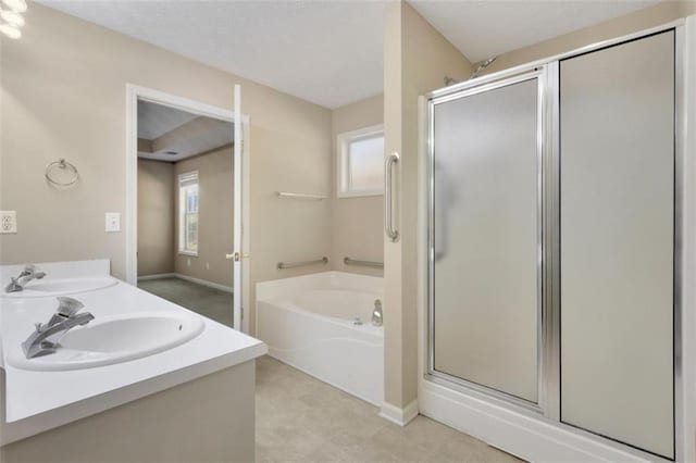 bathroom featuring plus walk in shower and vanity