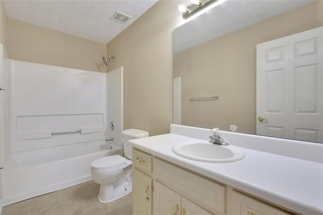 full bathroom featuring shower / tub combination, tile patterned flooring, toilet, a textured ceiling, and vanity