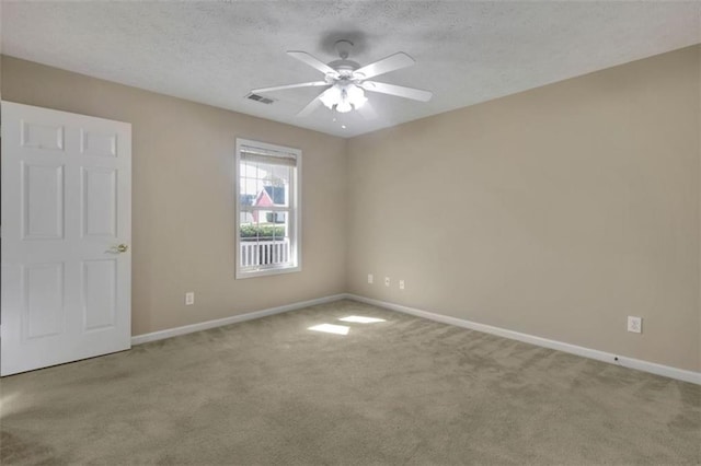 unfurnished bedroom with ceiling fan, carpet flooring, and a textured ceiling