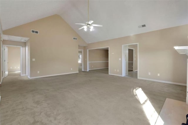 unfurnished living room with high vaulted ceiling, light colored carpet, and ceiling fan