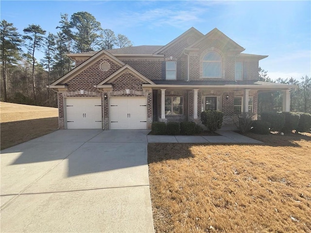 view of front of home with a porch, a garage, brick siding, concrete driveway, and a front yard