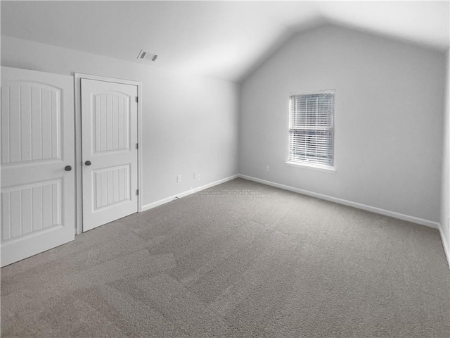 bonus room featuring lofted ceiling, baseboards, visible vents, and carpet