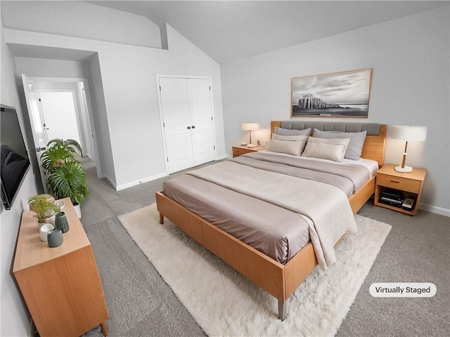 bedroom featuring lofted ceiling, carpet, baseboards, and a closet