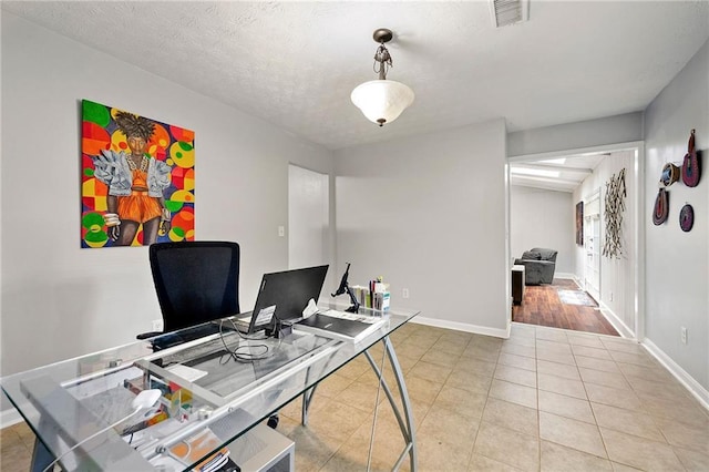 1328 Hidden Hills Pkwy, Stone Mountain, GA 30088 - office area with light tile patterned floors and a textured ceiling