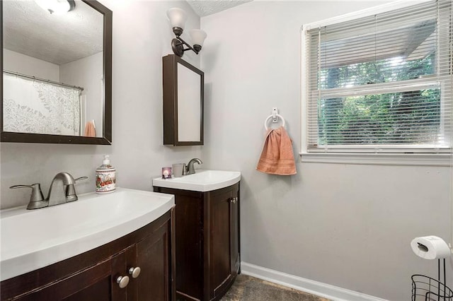 1328 Hidden Hills Pkwy, Stone Mountain, GA 30088 - full bath with two vanities and a textured ceiling