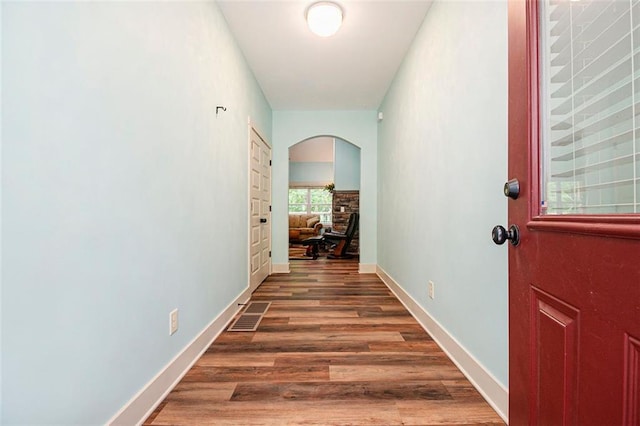 562 Yonah Lake Dr, Sautee Nacoochee, GA 30572 - corridor with arched walkways, wood finished floors, and baseboards