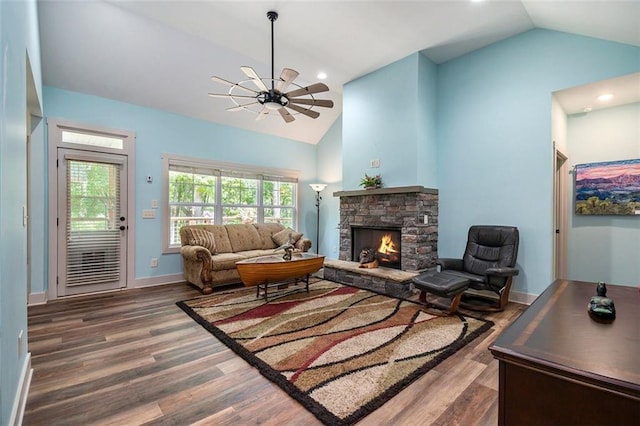 562 Yonah Lake Dr, Sautee Nacoochee, GA 30572 - living area with vaulted ceiling, wood finished floors, a fireplace, ceiling fan, and baseboards