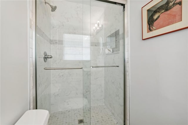 full bath featuring a shower stall