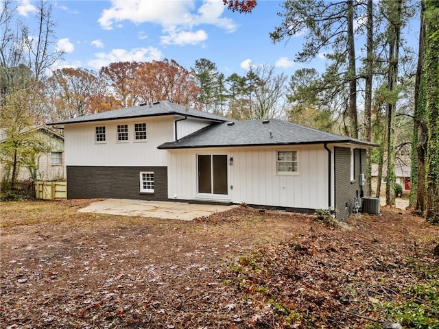 rear view of property featuring central AC and a patio area