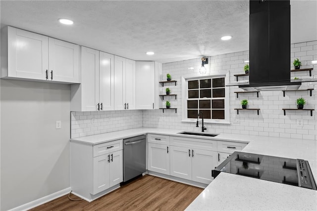 kitchen with extractor fan, sink, white cabinets, stainless steel dishwasher, and range