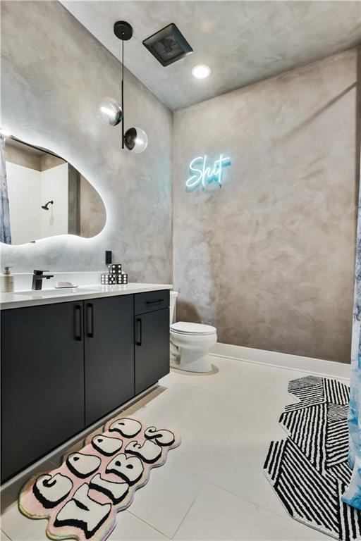 112 Rogers St NE Unit 505, Atlanta, GA 30317 - bathroom featuring vanity, toilet, and tile patterned floors