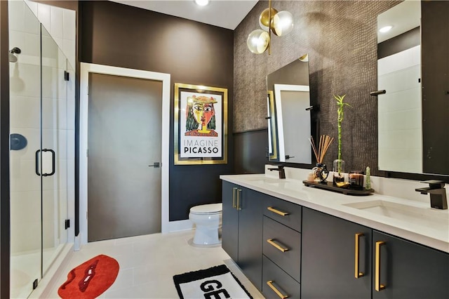 112 Rogers St NE Unit 505, Atlanta, GA 30317 - bathroom with double vanity, toilet, a shower stall, and baseboards