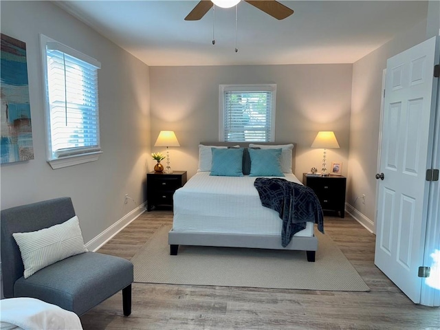 bedroom featuring hardwood / wood-style flooring and ceiling fan