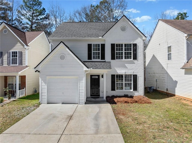 traditional-style house with roof with shingles, an attached garage, concrete driveway, a front lawn, and brick siding