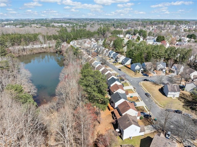 drone / aerial view featuring a residential view and a water view