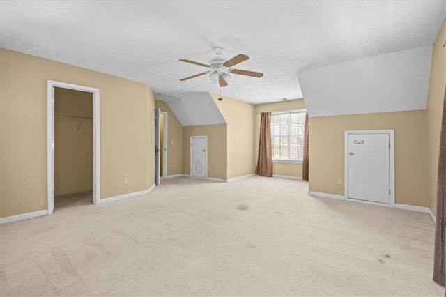 305 Hickory Pointe Ct, Villa Rica, GA 30180 - additional living space with ceiling fan, light carpet, vaulted ceiling, and a textured ceiling