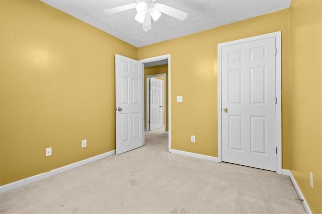 305 Hickory Pointe Ct, Villa Rica, GA 30180 - unfurnished bedroom with carpet floors, a textured ceiling, and a ceiling fan