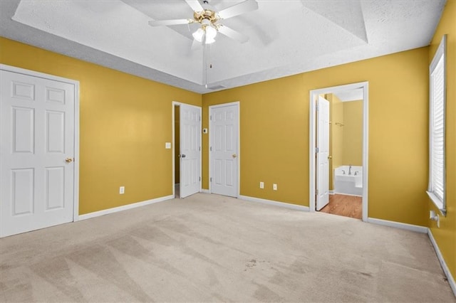 305 Hickory Pointe Ct, Villa Rica, GA 30180 - unfurnished bedroom with carpet flooring, ensuite bath, a textured ceiling, and a ceiling fan