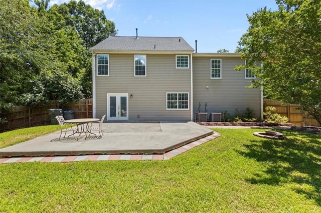 305 Hickory Pointe Ct, Villa Rica, GA 30180 - back of property with french doors, a fenced backyard, a patio, and an outdoor fire pit