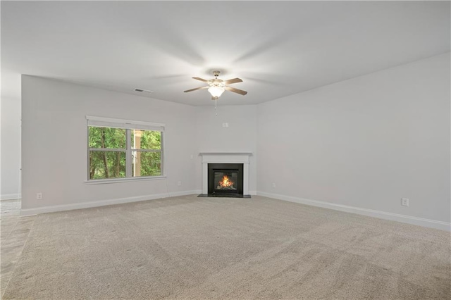 61 Castlemoor Loop, Adairsville, GA 30103 - unfurnished living room with light colored carpet, ceiling fan, baseboards, and a fireplace with flush hearth