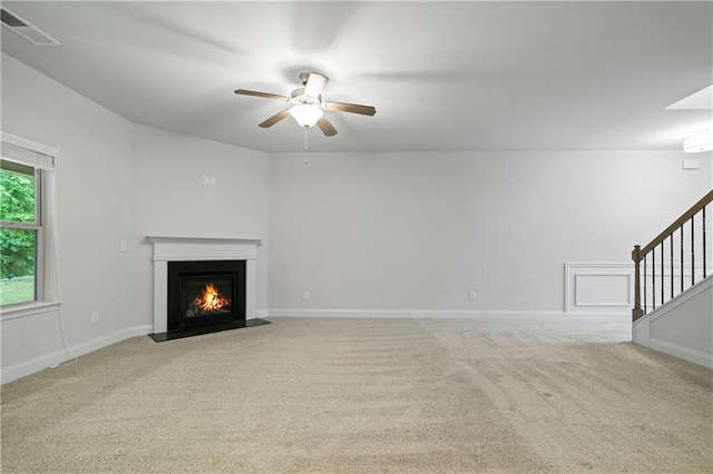 61 Castlemoor Loop, Adairsville, GA 30103 - unfurnished living room featuring ceiling fan, carpet floors, stairway, a fireplace with flush hearth, and baseboards