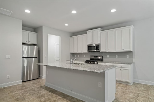 61 Castlemoor Loop, Adairsville, GA 30103 - kitchen with visible vents, a sink, baseboards, appliances with stainless steel finishes, and white cabinetry
