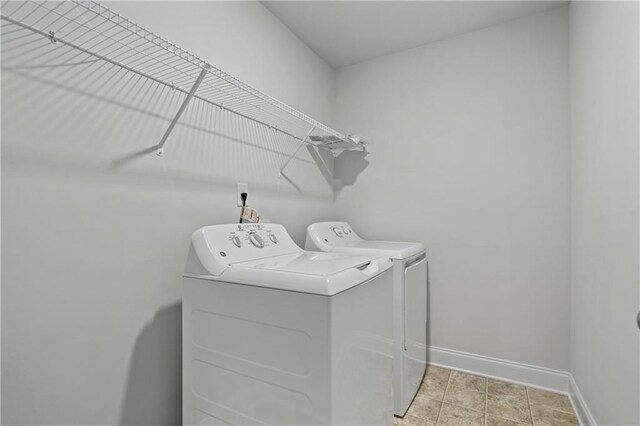 61 Castlemoor Loop, Adairsville, GA 30103 - laundry area featuring washing machine and clothes dryer, laundry area, and baseboards