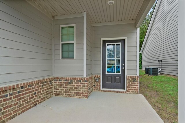 61 Castlemoor Loop, Adairsville, GA 30103 - entrance to property with brick siding, central AC, and a patio