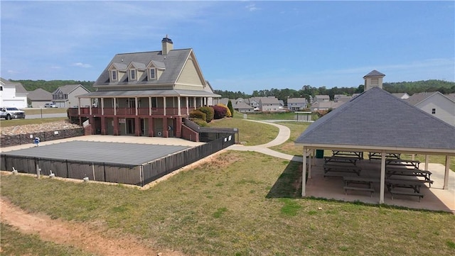 61 Castlemoor Loop, Adairsville, GA 30103 - back of property featuring a chimney, a gazebo, a yard, and a residential view