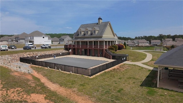 61 Castlemoor Loop, Adairsville, GA 30103 - back of property with a chimney, a residential view, and a lawn