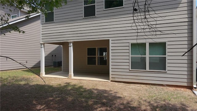 61 Castlemoor Loop, Adairsville, GA 30103 - rear view of property featuring a yard, a patio area, and central AC unit