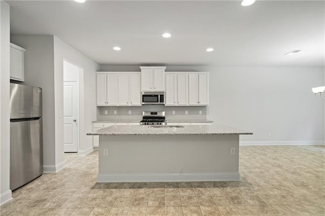 61 Castlemoor Loop, Adairsville, GA 30103 - kitchen featuring white cabinets, a sink, appliances with stainless steel finishes, and a center island with sink