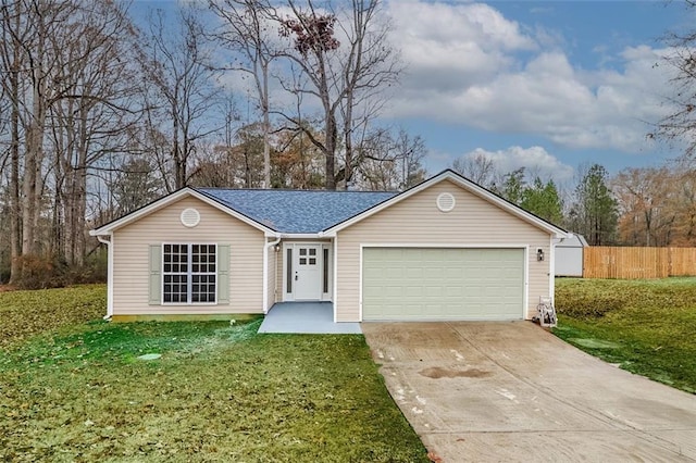 ranch-style house with a garage and a front lawn