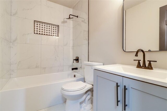 full bathroom with vanity, toilet, and tiled shower / bath