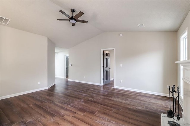 unfurnished living room with ceiling fan, lofted ceiling, and dark wood-type flooring