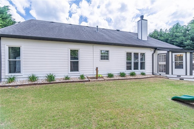 220 Chandler Ct, Sugar Hill, GA 30518 - back of property featuring a chimney, a yard, and roof with shingles