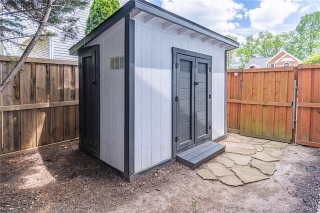 220 Chandler Ct, Sugar Hill, GA 30518 - view of shed with a fenced backyard and a gate