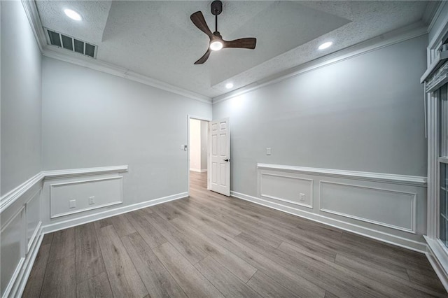220 Chandler Ct, Sugar Hill, GA 30518 - unfurnished room featuring a textured ceiling, ornamental molding, a ceiling fan, wood finished floors, and recessed lighting
