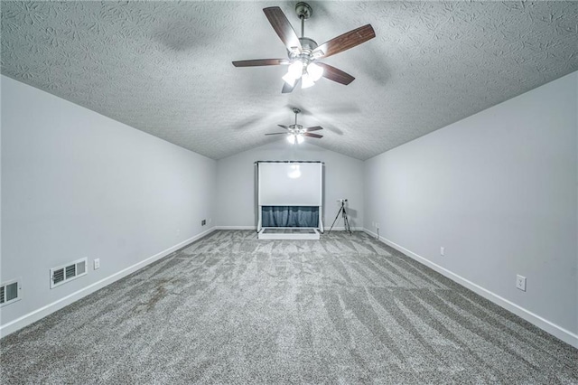 220 Chandler Ct, Sugar Hill, GA 30518 - additional living space featuring ceiling fan, carpet flooring, a textured ceiling, and vaulted ceiling
