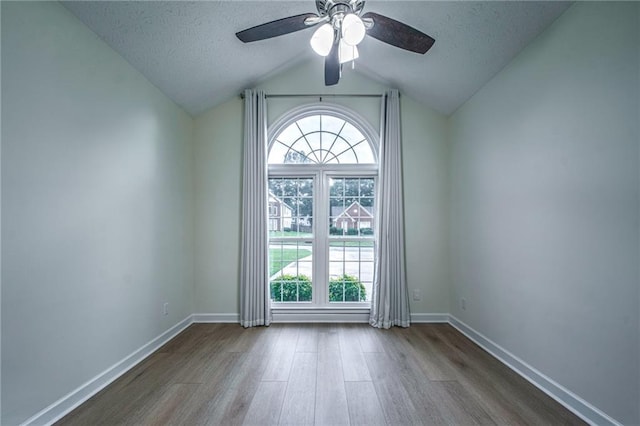220 Chandler Ct, Sugar Hill, GA 30518 - doorway to outside with wood finished floors, a textured ceiling, ceiling fan, and vaulted ceiling