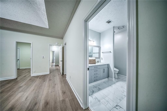 220 Chandler Ct, Sugar Hill, GA 30518 - hall with a textured ceiling and light wood-type flooring