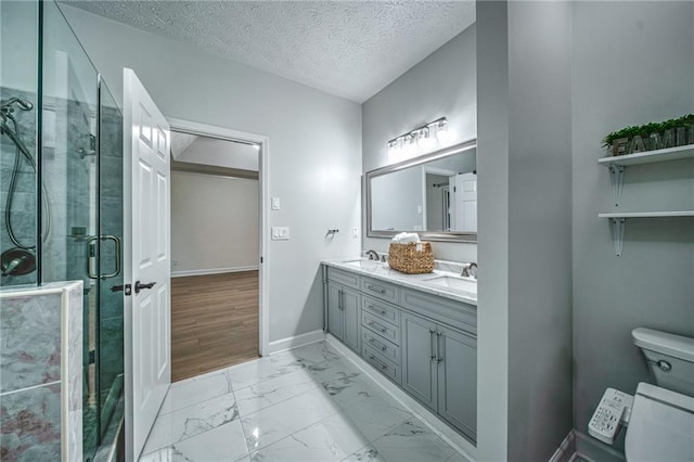 220 Chandler Ct, Sugar Hill, GA 30518 - full bathroom featuring marble finish flooring, double vanity, a textured ceiling, and a stall shower