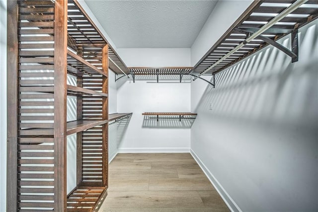 220 Chandler Ct, Sugar Hill, GA 30518 - walk in closet featuring wood finished floors