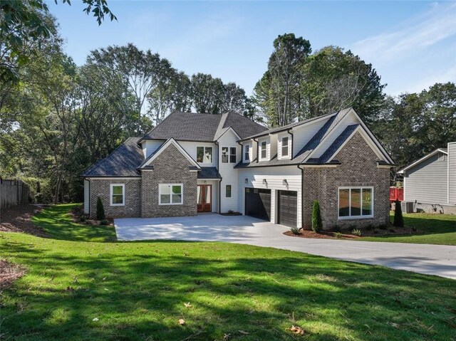 view of front of property with a garage and central air condition unit