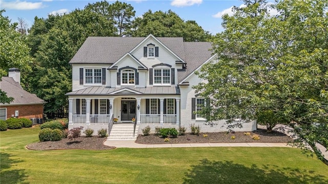 735 River Ridge Lane, Suwanee, GA 30024 - view of front of home featuring a porch, a standing seam roof, a front yard, and metal roof