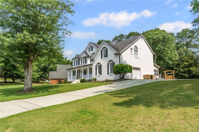 735 River Ridge Lane, Suwanee, GA 30024 - view of front of property with an attached garage, a front lawn, driveway, and covered porch